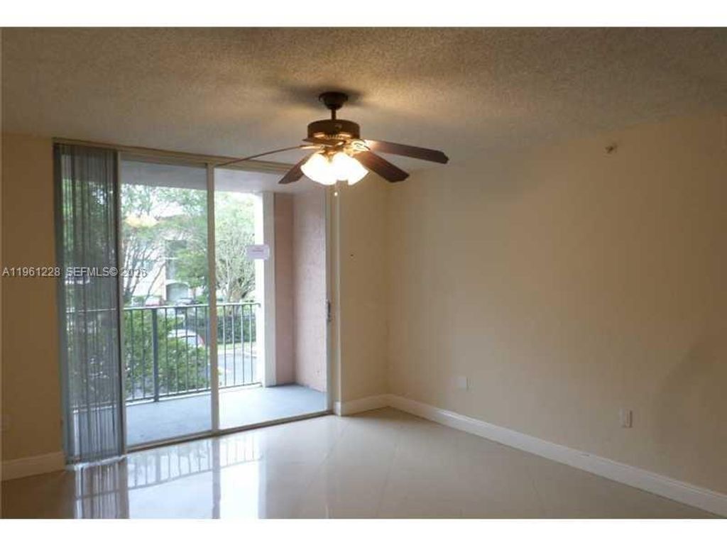 Photo of 12124 Saint Andrews Pl #209, Miramar, FL 33025 (MLS # A11961228)