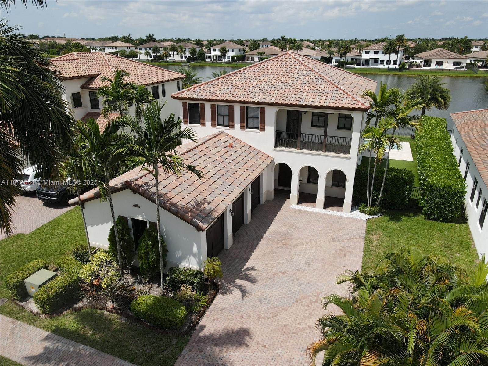 SPECTACULAR 5-BEDROOM, 3-BATH WATERFRONT HOME WITH UNFORGETTABLE VIEWS! THIS BEAUTIFUL TORTUGA MODEL OFFERS LUXURY, COMFORT, AND BREATHTAKING LAKEFRONT LIVING. ENJOY PANORAMIC VIEWS OF THE LAKE AND POOL FROM THE KITCHEN, LIVING AREA, AND PRIMARY SUITE. FEATURES INCLUDE A GUEST SUITE ON THE MAIN LEVEL, CHEF-INSPIRED KITCHEN, TRAVERTINE & MARBLE FLOORS, AND A PRIVATE TERRACE FOR STUNNING SUNSETS. THE LOFT HAS BEEN CONVERTED INTO A FIFTH BEDROOM, IDEAL FOR FAMILY OR GUESTS. ENHANCEMENTS INCLUDE WOOD-STYLE FLOORING, CUSTOM CLOSETS, WINDOW TREATMENTS, UPDATED LIGHTING, THREE-CAR GARAGE, AND AN OVERSIZED DRIVEWAY. RECENT A/C, WATER HEATER, WASHER & DRYER. THIS HOME IS A MUST-SEE—SCHEDULE YOUR PRIVATE SHOWING TODAY!