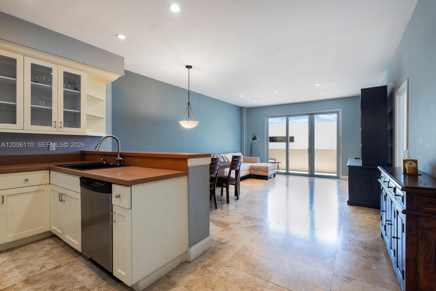 Spacious 1-bedroom, 1.5-bath residence on lanai level, featuring an updated kitchen and bathrooms, along with hurricane-impact glass for complete privacy. The unit includes 1 covered parking spot and a storage unit. Building amenities offer a bayside pool and fitness center. ideally located on Belle Isle near The Standard Spa, with easy access to Sunset Harbour, and the beach- all within walking distance.