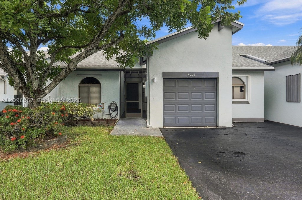 Photo of 8201 NW 100th Ln, Tamarac, FL 33321 (MLS # A12096867)