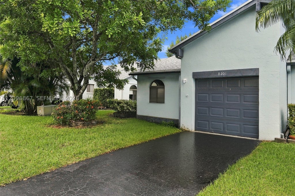Photo of 8201 NW 100th Ln, Tamarac, FL 33321 (MLS # A12096867)