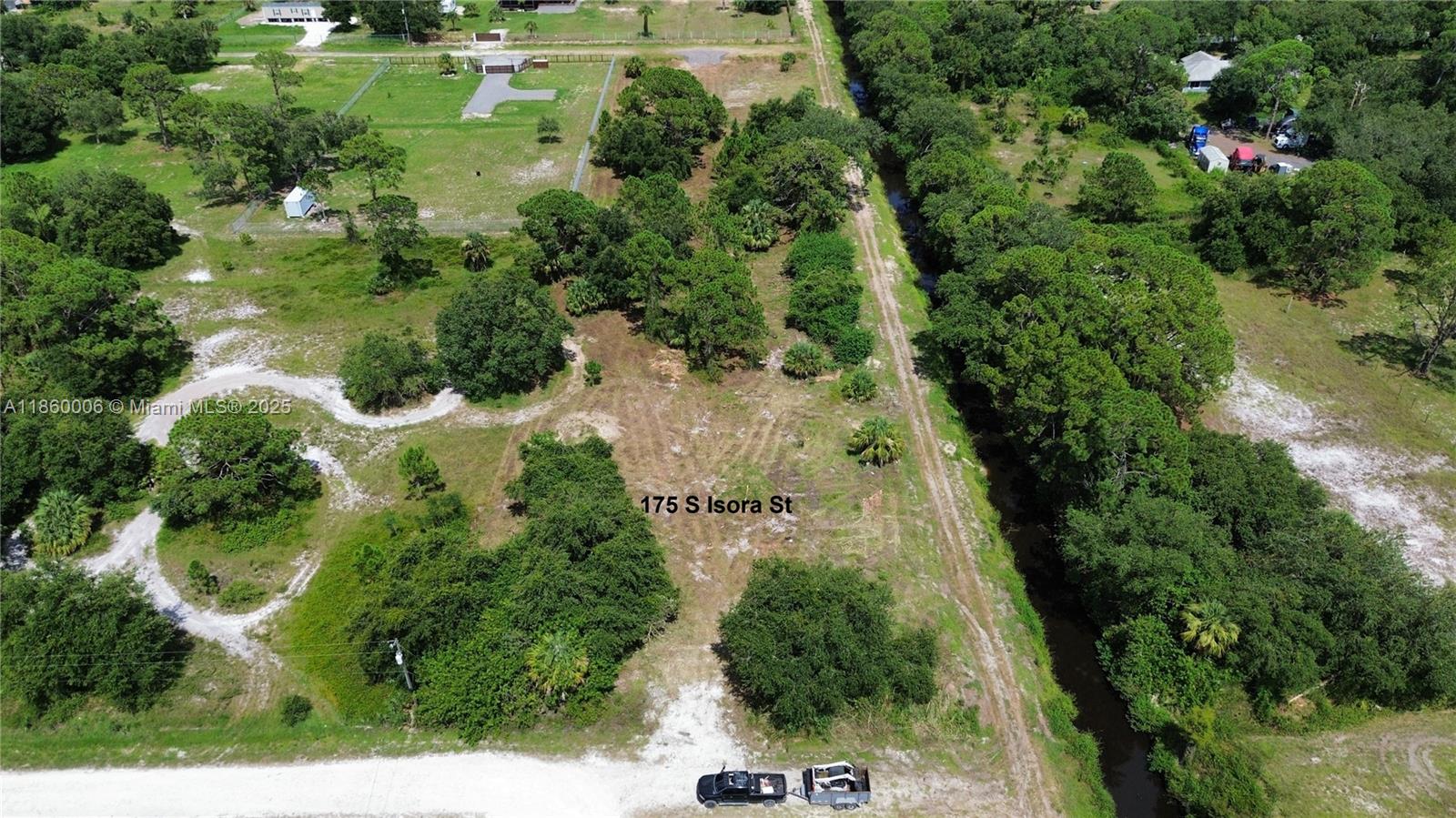 Two Adjoining 1.25 Acre Parcels in Montura Ranch Estates offered individually or together. Both have Surveys, Culverts & Driveways done with all permits, plus recently mowed and left beautiful Oaks, Pines and Palmetto Trees throughout the property. Both back up one to another and have the access road along the side where the CCWCD canal runs, they are High and Dry in Flood Zone X with excellent drainage. Properties are very close to the Community Clubhouse and Recreation Area. Ready to make plans to use as a Family Farm, Recreation or Build Modular, Manufactured or CBS Home as all are permitted. Many neighbors and adjacent parcels that are built and being developed, this is not a remote or secluded part of Montura, there is life throughout this sector. Arial video available watch it below.