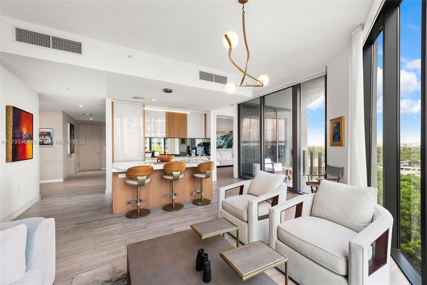 Discover luxury living at Park Grove's Club Residences, crafted by renowned architect Rem Koolhaas in the heart of Coconut Grove. The elegant unit features 10' ceilings, sleek porcelain flooring, premium Wolf+Sub Zero appliances, and a versatile split layout with a private den. Impeccable high-end finishes elevate every detail. Spanning 5 acres, Park Grove boasts lush gardens and top-tier amenities, including a private screening room, a wine tasting room with storage options, full-service signature spa, a state-of-the-art fitness center, multiple pools w/ cabanas & BBQ area, poolside restaurant (w/ in unit delivery) and a rooftop pool with breathtaking views. Unit comes w/ valet parking. Located just steps from CocoWalk’s vibrant shops, restaurants, cafés and bars, your dream home awaits!