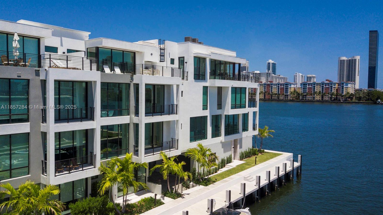 Welcome Home to Peace and Serenity. Townhouse 6 is located on the Inter-Coastal Waterfront of the 2024 Built,
Koya Bay Townhouse Community within the gated Eastern Shores neighborhood. Be the first to live in a home that is bathed in natural light spread across 4 stories of living space. The 3500 sq ft comprises of 4
Bedrooms 4.1 Bathrooms. It can be rented furnished if preferred, in this case the monthly rate will increase. The floor-to-ceiling impact glass fully stacking doors effortlessly brings the outside in creating a seamless flow throughout each story. The owner spared no expense, the customized wall paneled kitchen houses top of the line Wolf & SubZero Appliances & Wine Aficionado's are in for an incredible surprise! Lastly the property is pre-wired w/ a Smart Home Electronics.