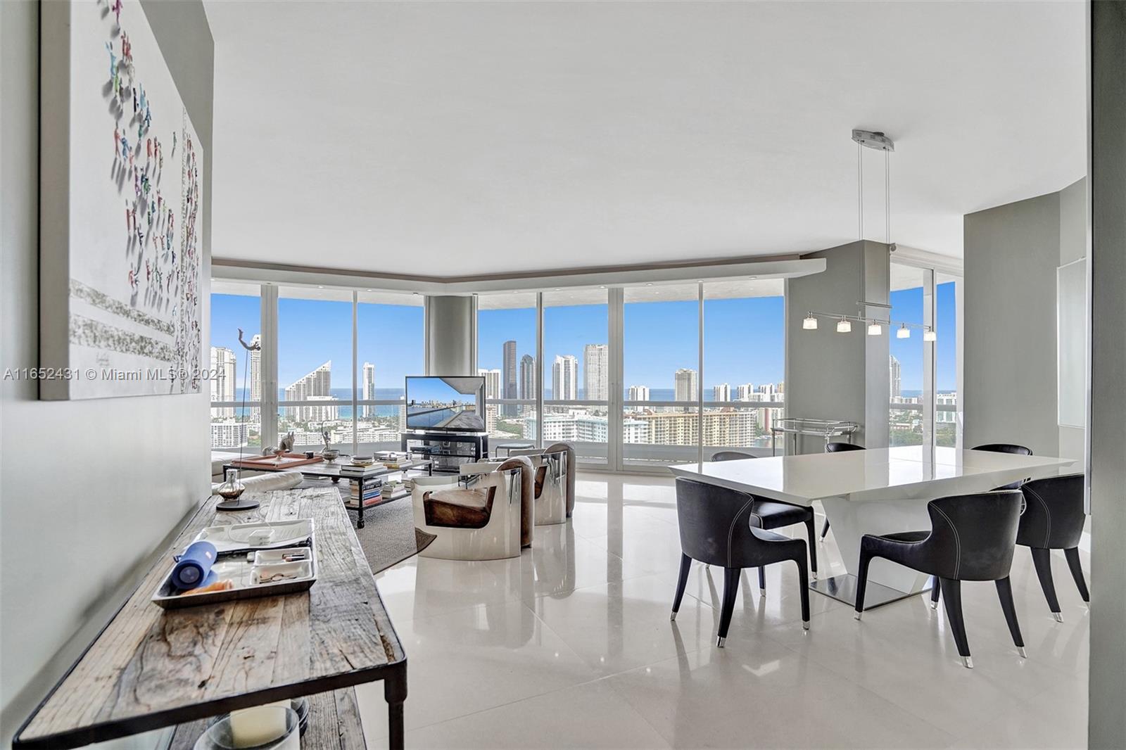 HIGH FLOOR DESIRABLE 3 BED 3 BATH FLOOR PLAN IN SOUGHT AFTER 2600 BUILDING ON WILLIAMS ISLAND. PRIVATE ELEVATOR TAKES YOU TO THIS CORNER TOWER SUITE UNIT W/ HIGHER CEILINGS & SPECTACULAR OCEAN & INTRACOASTAL VIEWS FROM THE WRAPAROUND TERRACES. COMPLETE HURRICANE IMPACT WINDOWS & DOORS, ELECTRIC BLINDS, EXQUISITE LIMESTONE FLOORING IN LIVING AREAS AND PORCELAIN FLOORS IN BEDROOMS. FURNISHED AND EQUIPPED FROM ROCHE BOBOIS AND RH. ENJOY THE PRESTIGIOUS WILLIAMS ISLAND WORLD CLASS AMENITIES: DAILY BARISTA BAR, GYM, PARTY ROOM, MOVIE THEATER, BILLIARD ROOM, 15 WORLD CLASS TENNIS COURTS, 4 PICKLEBALL, 3 RESTAURANTS, STARBUCKS, 27,000 SQ FT GYM & SPA, DOG PARK, 105 SLIP MARINA, WALKING PATH, KIDS PLAYGROUND, COURTESY BUS, SOCIAL ACTIVITIES, VALET, CONCIERGE, CLOSE TO AVENTURA MALL AND A+ SCHOOLS.
