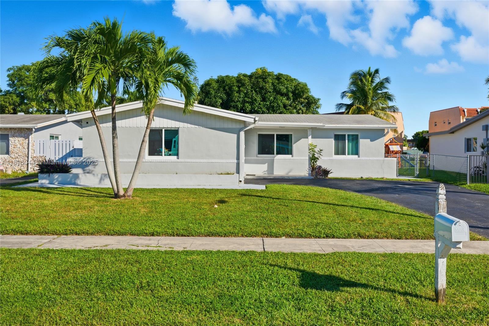 Enjoy peaceful lake views from the main living areas and screened-in patio — an ideal setting to relax or entertain. With extra yard space and a mango tree, this home offers a quiet, outdoor lifestyle unique to South Florida. Features include a 2018 roof, impact-rated front and rear windows, and hurricane shutters on all side windows. The open layout includes updated flooring, a modern kitchen with quartz countertops, and stainless steel appliances. All new PVC plumbing and a gas water heater were installed in 2019. Additional highlights: one-car garage with hurricane-rated door, split-bedroom layout, and laundry in garage. No HOA. Located on a quiet street with easy access to schools, shopping, dining, and major highways.