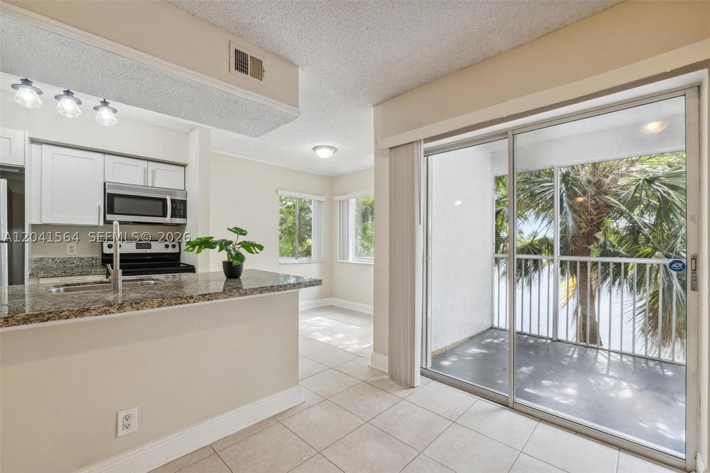 Photo of 5672 Rock Island Rd #254, Tamarac, FL 33319 (MLS # A12041564)