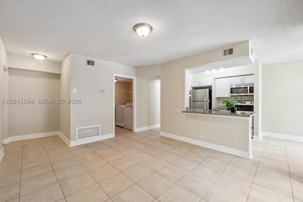 Photo of 5672 Rock Island Rd #254, Tamarac, FL 33319 (MLS # A12041564)