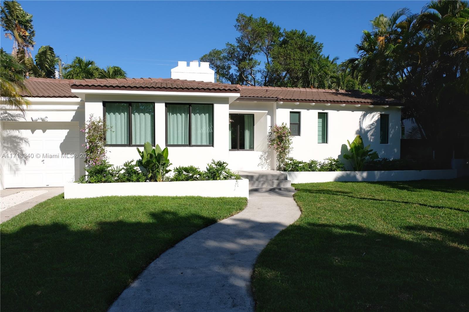 A must see. Discover a charming Wabi Sabi meets Spanish Colonial home in Belle Meade — one of Miami’s most coveted gated neighborhoods. The recently renovated house hosts three spacious bedrooms, two bathrooms and a large living, dining and lounge area that leads to the kitchen. A spacious 1-car garage serves as the dedicated laundry area. Original details to the home, making it truly unique, include wood beam ceilings, stone fireplace, spanish tile floors, travertine floors, and pine hardwood floors. Great features: historic charm with modern updates; impact windows and doors; brand-new kitchen appliances and interior finishes; and room for a pool on this large 8,850 SF lot —just blocks from parks, dining, shops and top schools — all on a quiet street in this exclusive gated neighborhood.