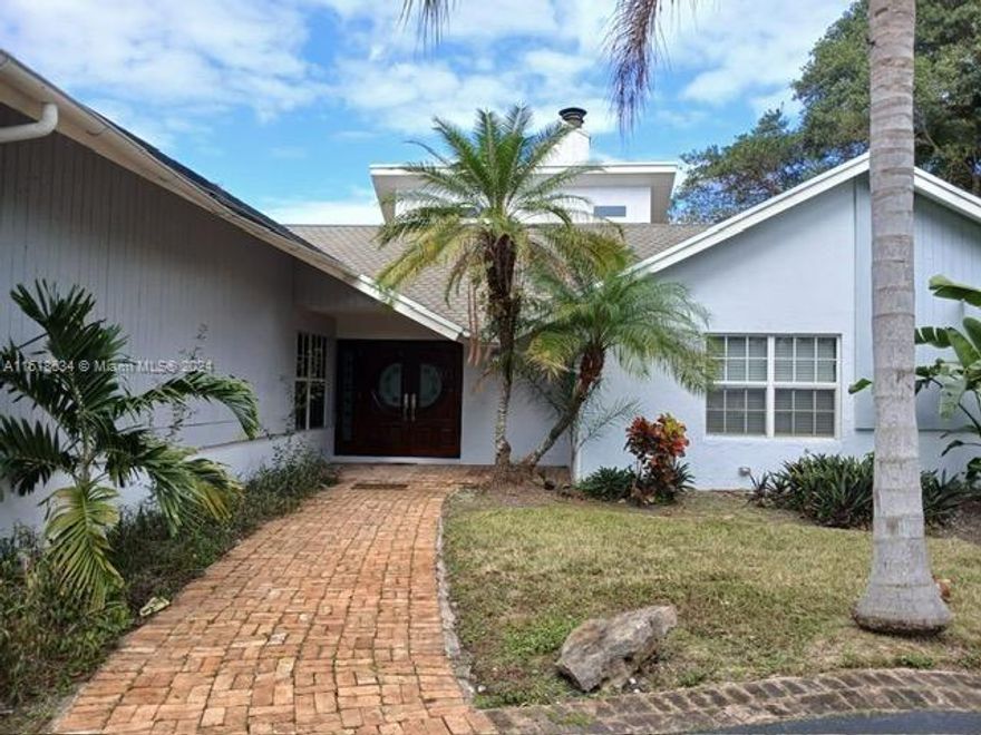 Extraordinary Residence, gorgeous neighborhood over One acre. Corner lot in the Continental Park area, Circular driveway, open and spacious gourmet Kitchen with Top-of-the-line stainless steel appliances, giant family room, high ceilings, grove Frech door, title & wood floors, impact windows and doors , master suit with sitting area and large bathroom jacuzzi tub and separate shower & 2 giant master closets , heated pool , Toki hut with bar and BBQ Fruit trees , room for boat **** this house is perfect for enjoy the life with family ****