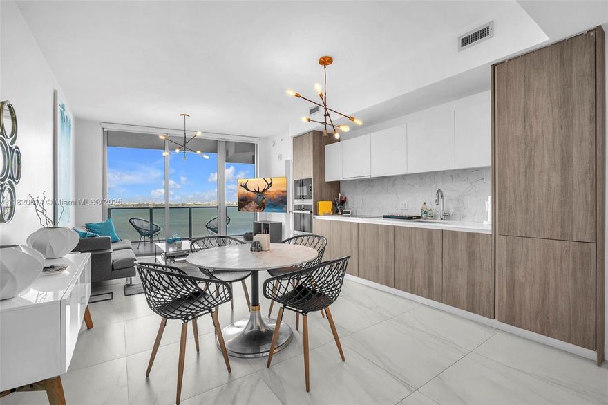 Enjoy spectacular views of Biscayne Bay and 5-star amenities in this elegant 2-bedroom, 2-bathroom condo. Featuring luxurious finishes throughout, including upgraded floors and Miele stainless steel appliances, built-out walk-in closet, floor-to-ceiling hurricane impact windows and sliders, full size washer and dryer in unit, and elevator leading directly into a private foyer. Biscayne Beach offers an array of 5-star amenities, such as two pools, cabanas, a beach club, two tennis courts, and a basketball court. Stay fit with a bay-view fitness gym, take advantage of the dog park, or unwind at the spa and beauty salon. Additional conveniences include a business center, BBQ area, and much more, ensuring a lifestyle of luxury and comfort.