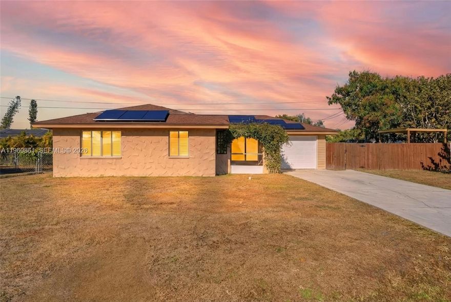 Nestled in the highly desirable McGregor corridor, this inviting home offers a blend of comfort, style, and everyday Florida living. The open great room layout creates an easy flow for daily life and entertaining, complemented by sleek dark plank tile flooring that adds a modern, cohesive feel throughout. The kitchen is thoughtfully designed with tasteful finishes and a clean, polished look that opens seamlessly to the main living space. The primary suite serves as a relaxing retreat, featuring a beautifully finished bathroom with a spa-like shower and eye-catching pebble tile accents. Step outside to a fully fenced backyard where a mature mango tree adds charm and a true sense of place, perfect for quiet mornings or evening unwinding. With a new roof installed in 2018 and a location just minutes from shopping, dining, and the scenic beauty of McGregor Boulevard, this home delivers both peace of mind and a lifestyle that’s hard to beat.