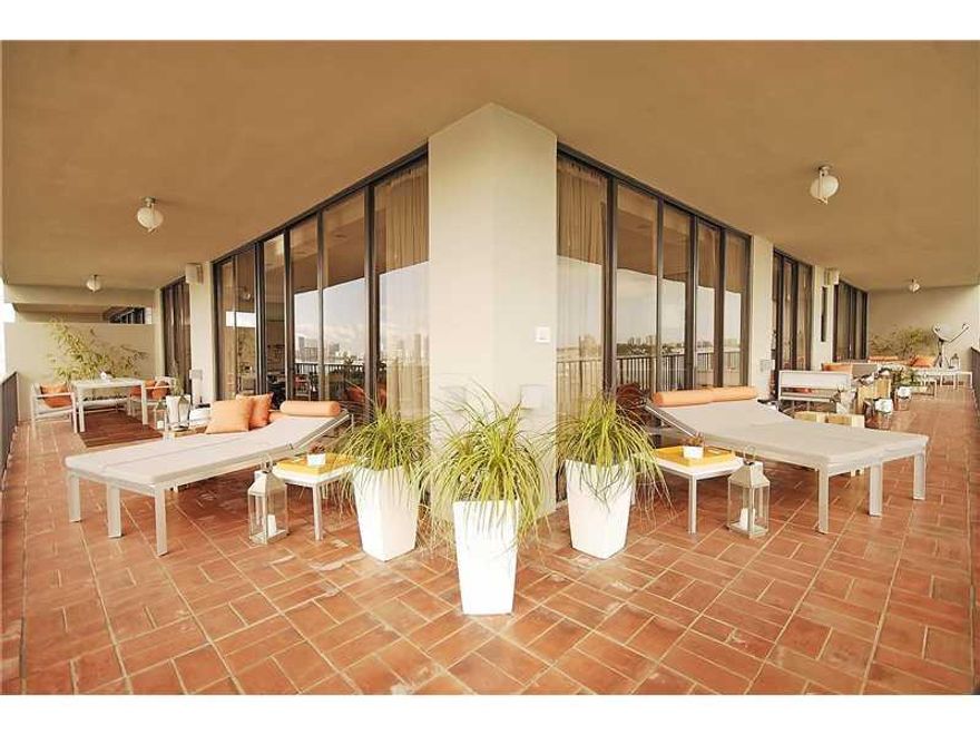 An exquisitely refined sense of style & great attention to detail are found in this custom floor plan featuring 1,720 SQ FT of living space + an 800 SQ FT wraparound balcony. This corner residence showcases touch screen integrated multimedia system by Ela n. Luxurious appointments include Carrera marble counters in kitchen & bath, Miele range/cook top, custom ebonized wood cabinetry, aged Wheat Oak & marble floors, frosted tempered glass doors, built-in Italian closets, custom Tech Lighting & more.