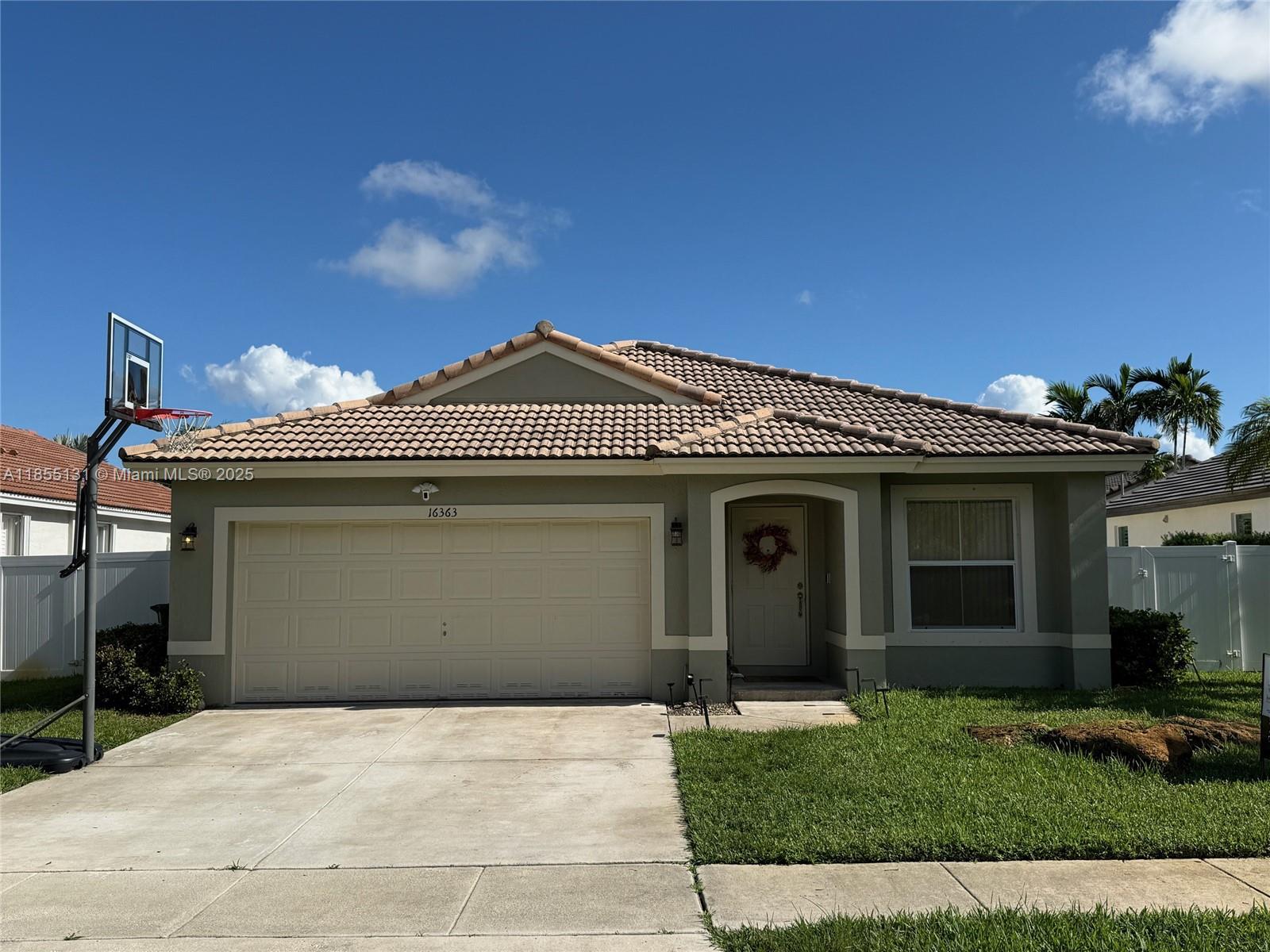 Charming 3 bedroom, 2 bath Pool home located in the guard-gated community of the Beaches at Pembroke Shores! This single story gem features a bright, open floor plan with vaulted ceilings and spacious living and dining areas. Boasting ceramic tiles in the living areas recently renovated bathrooms. The Air conditioning unit was just recently installed. The private fenced backyard with a pool is perfect for relaxing and entertaining. Located in proximity to Interstate I-75, the Florida turnpike and is Conveniently located to all the amenities! Your Dream Home actually does exist.....come see for yourself!