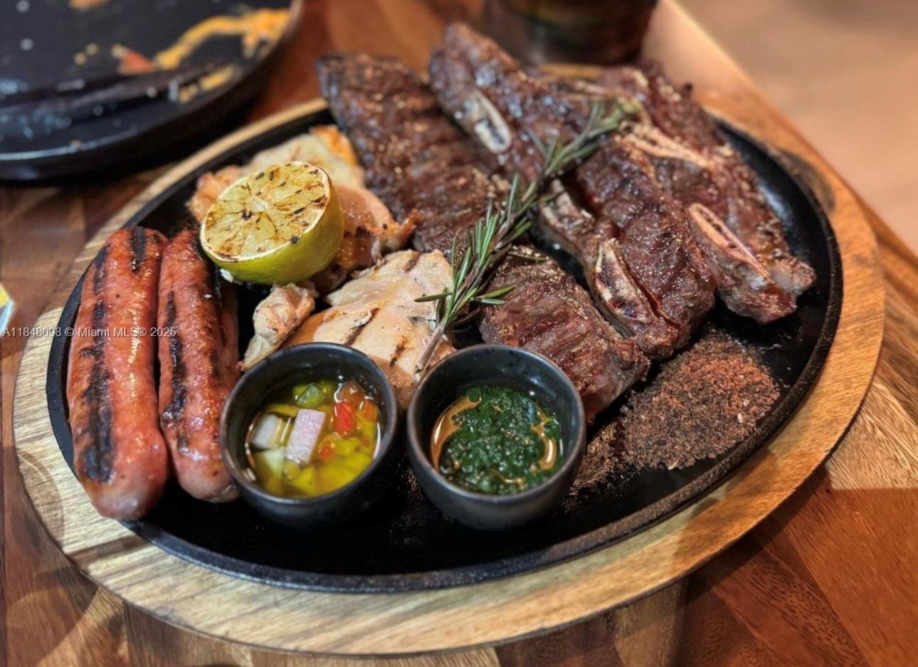 Exceptional opportunity to acquire a well-established Argentinian steakhouse in a prime location. This turnkey operation offers a dynamic blend of authentic cuisine, and live entertainment. Situated in a high-traffic area, includes a fully built-out kitchen, elegant dining space, and potential market section all meticulously maintained and ready for immediate operation. With a loyal customer base and growing popularity, the business shows strong room for expansion and growth , including catering, events, or franchising potential.
Ideal for both local and international buyers, this business may qualify for Visa program, offering a clear path to U.S. residency through investment. A rare chance to own not just a business, but a cornerstone of Miami’s cultural and culinary landscape.
