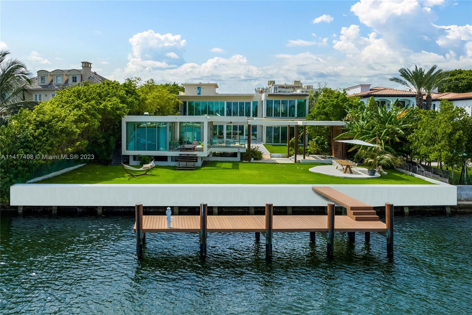 This multi-level 9BR/10+3BA waterfront property is located on exclusive Pine Tree Dr in Miami Beach boasting a 43,900 SF estate-sized lot w/100 ft of water frontage & enjoying one of the best views. Rare opportunity to customize the existing 13,000+ SF home into a dream 17,000 SF+ estate. Masterfully designed, expansive living, family & entertainment areas seamlessly blend indoor-outdoor luxury living. Custom Koi pond, 2nd floor pool, ground floor pool w/lounge areas, tropical landscaping, a pool house & gym-can be converted to 10th BR. Large private roof top lounge to entertain, private dock, plus access to the Biscayne Bay & Atlantic Ocean complete this unique estate. Sold As-Is, plans for expansion not included.