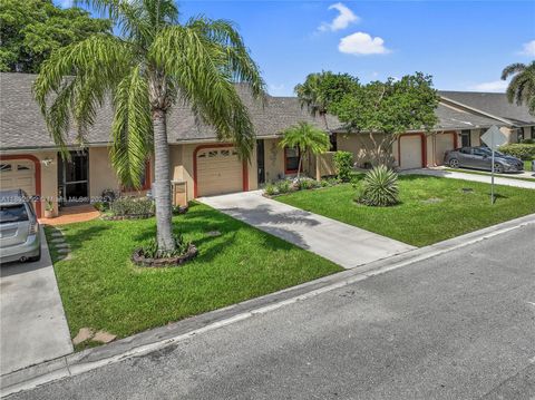 Photo of 7641 NW 99th Ave, Tamarac, FL 33321 (MLS # A11892992)