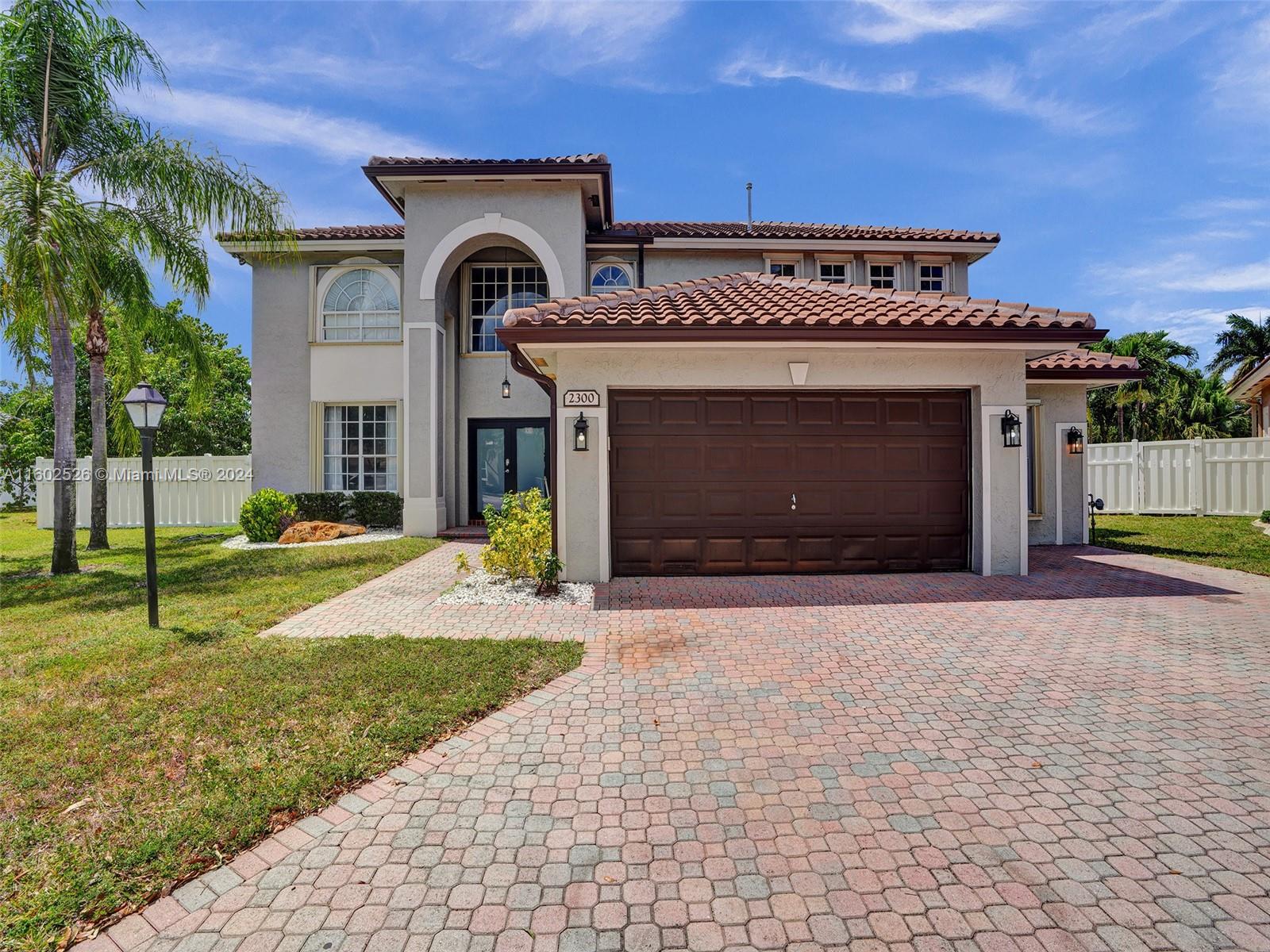 Walking into this elegant 5 bed/4.5 bath home nestled on a huge, private, fenced-in lot, you will find peace and tranquility. Located in the desirable Pembroke Falls community, this home spans 3,317 square feet and features a stunning kitchen with a gas stove, granite countertops, stainless steel appliances, 42" cabinets, and a pantry. The open floor plan includes a spacious family room and crown molding throughout. The builder has converted the 3rd car garage into 2 separate bedrooms with their own bathroom, providing additional living space. Offering a sophisticated family lifestyle, this home is conveniently close to shopping, restaurants, I-75, the airport, and beaches.