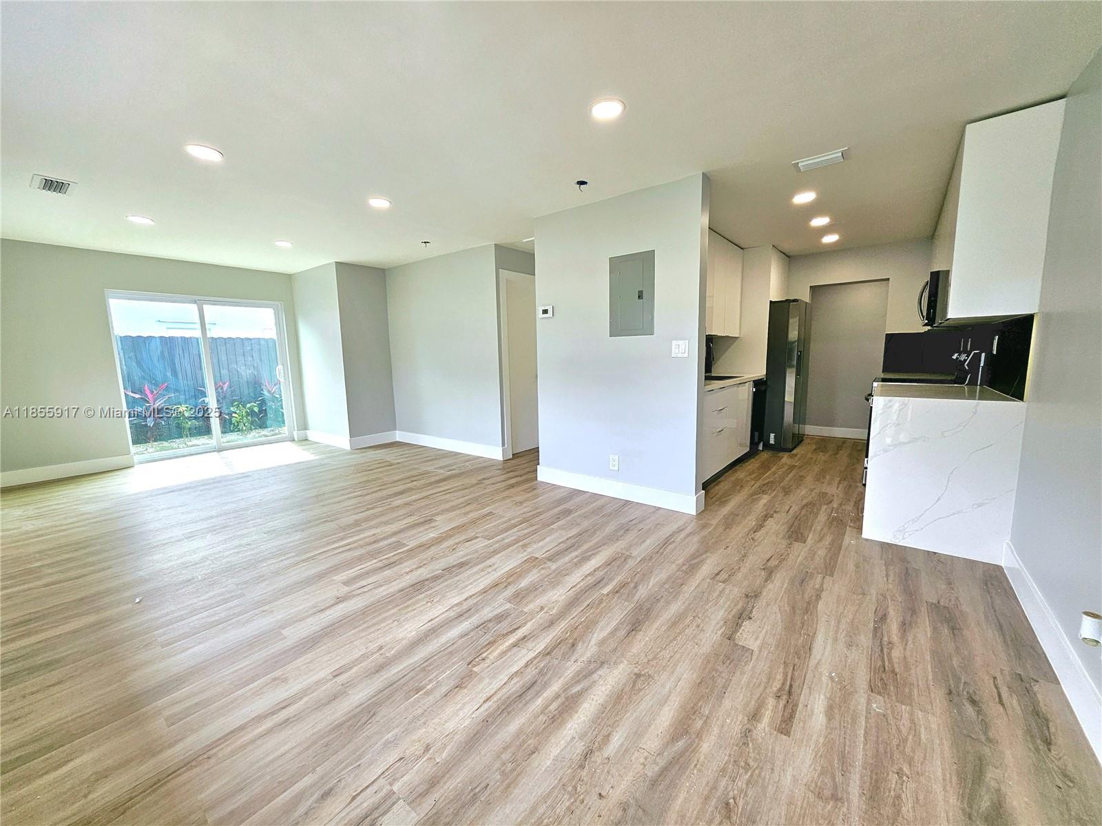 Welcome home to this spacious and meticulously renovated 5-bedroom, 3.5-bath property totalling 1,650 SQFT under air. Every detail has been carefully considered, showcasing modern finishes throughout. The generous floor plan includes a fantastic playroom with a wet bar, offering a versatile space for recreation, relaxation or a dedicated guest suite offering visitors a comfortable and private retreat during their stay. The spacious primary bedroom featuring convenient sliding glass doors that open directly to the lush backyard – perfect for enjoying a morning coffee al fresco or a peaceful evening breeze. Thoughtfully designed his and hers closets, offering abundant space for personal belongings. The yard offers room for relaxation and entertaining. This is a must-see property.