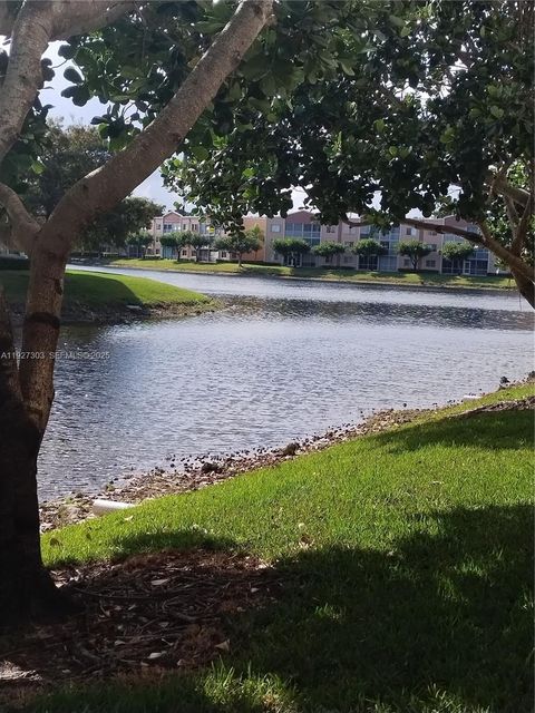Photo of 7557 Granville Dr #305, Tamarac, FL 33321 (MLS # A11927303)
