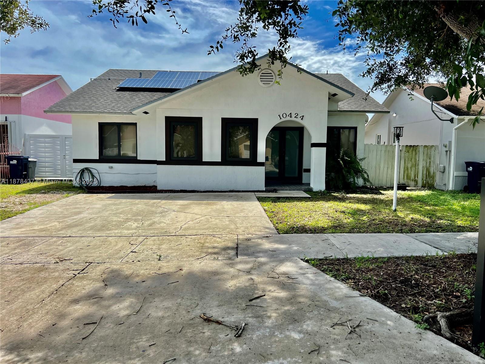 Check out this beautifully kept 3-bedroom, 2-bathroom home with tile floors, a newer roof and A/C, and a cozy layout great for entertaining. It boasts impact windows and doors, solar panels, and even a Tesla charging station. The backyard is perfect for relaxing or hosting, complete with a metal-roofed gazebo. All this in a peaceful neighborhood with no HOA!