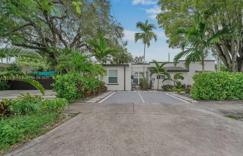 Investor’s dream opportunity! This exceptional duplex/triplex sits on a prime 7,500 sq ft corner lot in sought-after East Shenandoah—just steps from Coral Way, US1, Brickell, and Coconut Grove. The property features three separate units: two 2 bed / 1 bath apartments and one 1 bed / 1 bath unit. Ideal for rental income, multi-gen living, or live in one and rent the others. With ample on-site parking, the lot offers strong potential for expansion or redevelopment. The backyard is a highlight, with a summer kitchen including a built-in BBQ, fridge, and TV under a cozy Tiki Hut—perfect for entertaining. Jet ski included! Don’t miss this rare opportunity in a thriving, high-demand area.
