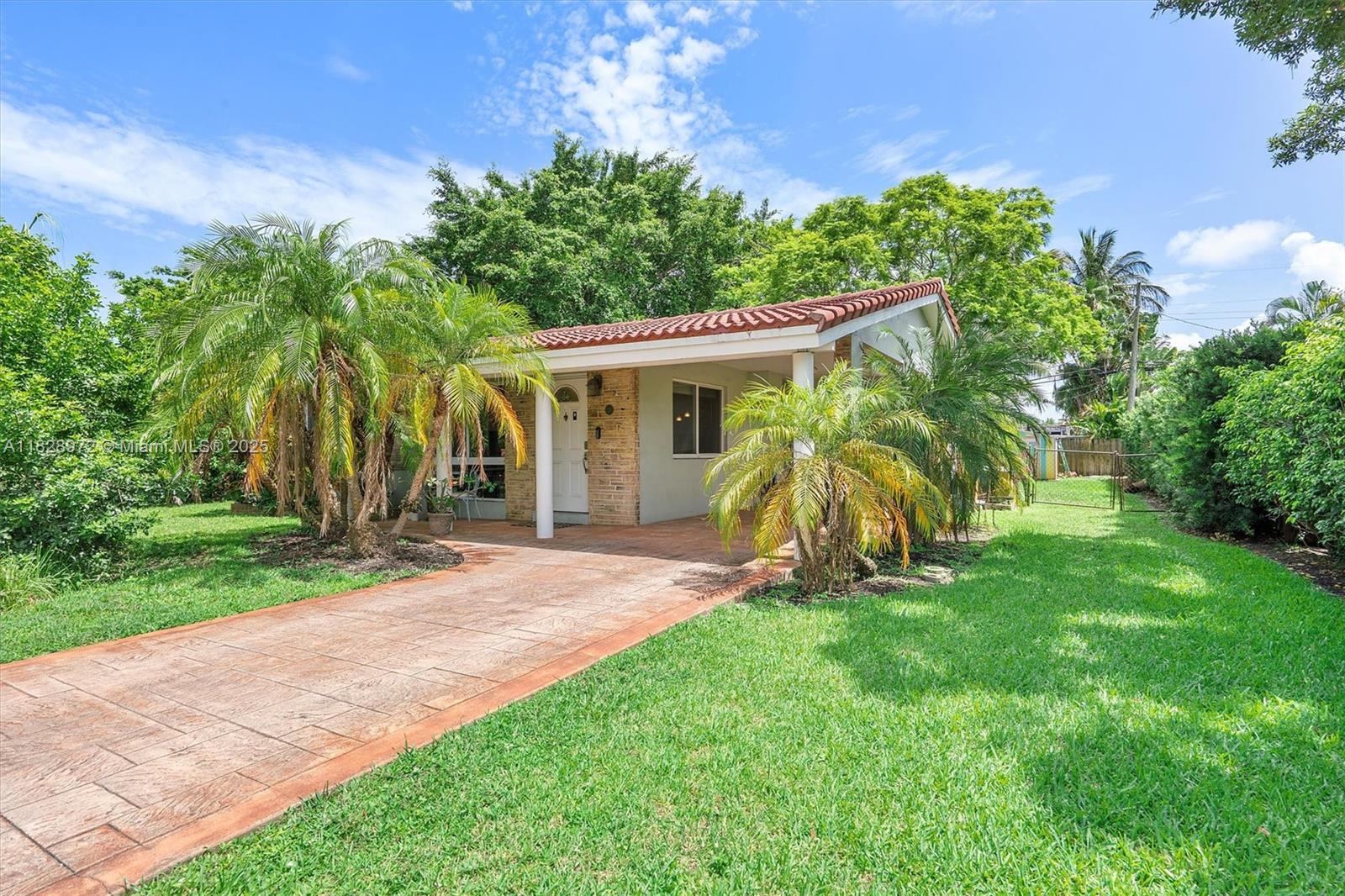 Located in the sought-after Lloyd Estates neighborhood, this well-maintained 2-bedroom, 2-bath home offers comfort and convenience. Recent upgrades include a S-tile roof installed in 2020, impact windows, and a new A/C system from 2021. The spacious layout opens to a large backyard with ample room to add a pool or create your own outdoor retreat. A well-fed sprinkler system helps keep the lawn lush year-round. Enjoy close proximity to local gyms, grocery stores, and restaurants, with easy access to Wilton Drive, I-95, and Fort Lauderdale Beach. Seller is willing to help with Buyer's Closing Costs.