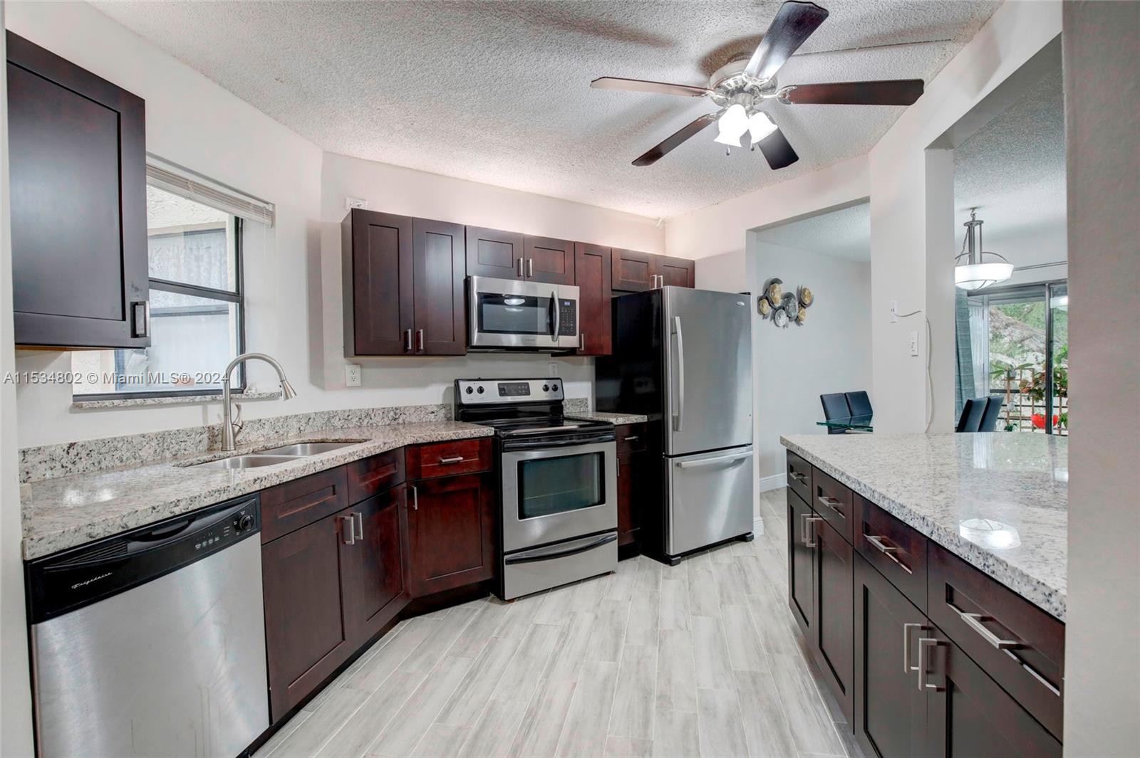 Wake up every day to a beautiful sunrise and the gorgeous views of the courtyard and the swimming pool from the privacy of your balcony.  Experience peace and quiet in this stylish and cozy well maintained two-bedroom / two-bathroom unit full of natural light and featuring sleek tile flooring.  Entertain with ease in the updated gourmet kitchen equipped with stainless appliances, stunning granite countertops and breakfast bar.  Boasting 1,120 sq.ft. of open spaces, this comfortable modern living unit is located in one of the most desirable complexes in the area.  HOA includes water, swimming pool, club house, game room with pool & ping-pong tables, gym, sauna, hot jacuzzi, and a ballroom. Look no further and start calling this hidden gem your home and your paradise.