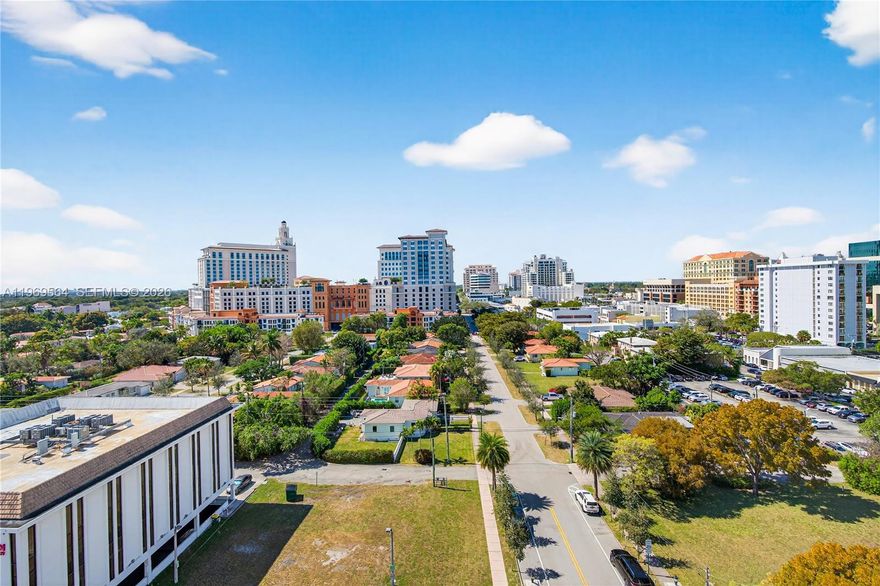 2-bedroom, 2-bath condo in a prime urban location just across from Coral Gables, offering fantastic open views and an unusually private feel for the city core. The bright, functional split floor plan provides added privacy for each bedroom. Features include tiled flooring throughout, hurricane-impact windows, a kitchen with granite countertops, abundant storage, and a spacious laundry closet. Covered parking included.

Building amenities include pool, fitness center, business center, concierge, and meeting room—ideal for working from home or hosting. The building was recently painted with no special assessments. Unbeatable convenience: approx. 15 minutes to Miami International Airport, about 20 minutes to the beach, and just a few blocks to Miracle Mile and The Plaza for dining, shopping, and everyday essentials.