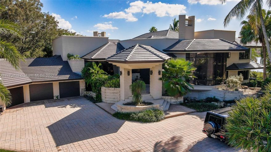 Cash Buyers only. previous buyer defaulted closing. Needs TLC. Award-winning for architecture & design custom built two story waterfront home on a premier 1.37 acre lot in prestigious Windmill Ranch Estates. This luxurious multi-level estate includes 6 bed 9 baths, 11,101 total sf. Frank Lloyd Wright inspired home was constructed w/ the highest quality and craftsmanship. Features include a formal living room with fireplace, climate-controlled wine cellar, media room, gourmet kitchen & wet bar. Expansive two-story primary suite w/wood fireplace on the first level & bonus loft & balcony with amazing panoramic lake views on second level. Entertain or relax in your ultimate 1,600+ sq. ft. screened-in outdoor living area w/marble floors & summer kitchen or the private oversized pool & spa area.