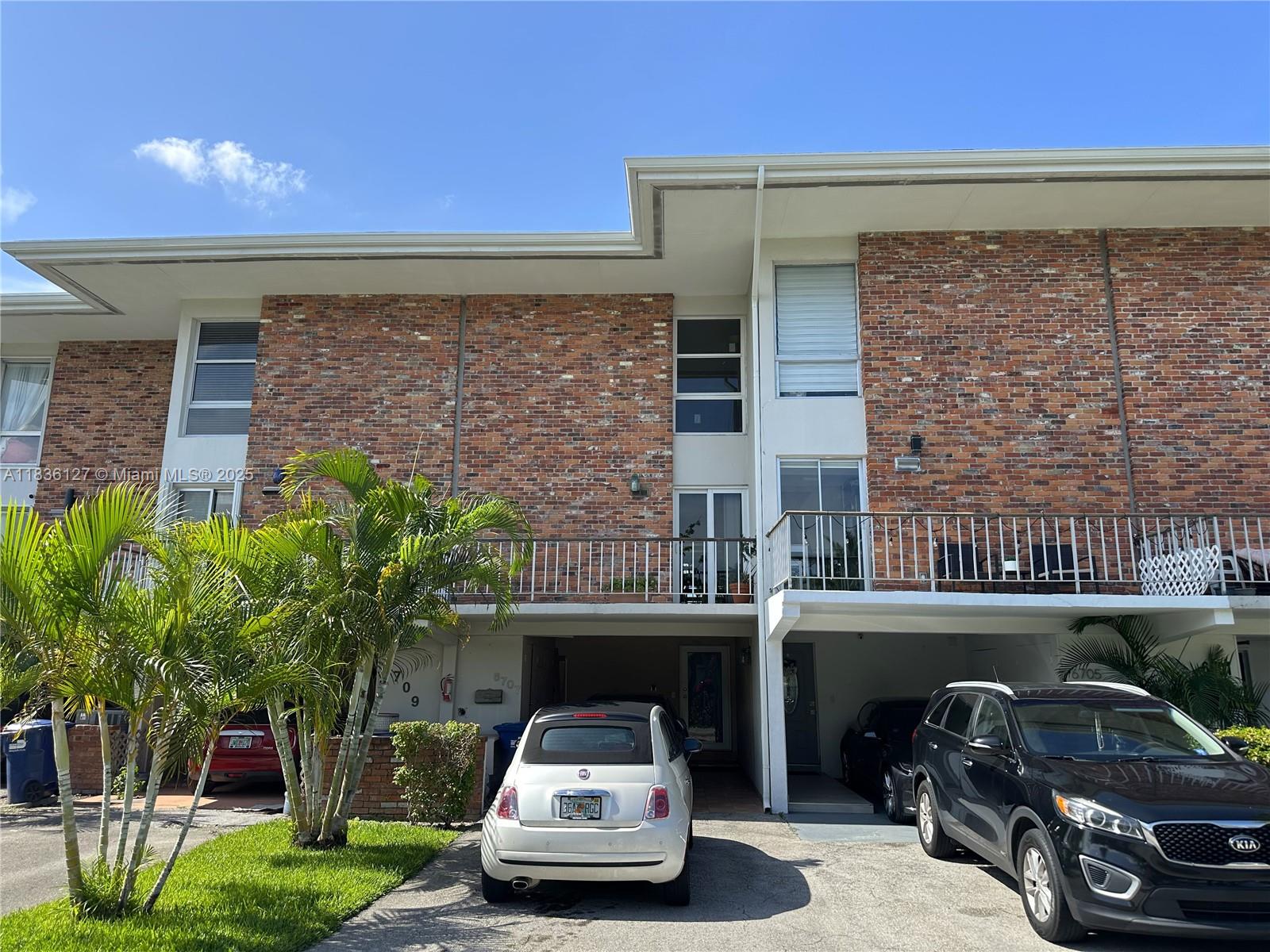 Welcome to the prestigious Country Club of Miami. Rarely available, 1,752 sf townhouse overlooking the golf course. This property features an fantastic architectural design which features 13.5 foot ceilings in the living area with floor to ceiling windows. This design language continues in the very spacious primary bedroom with floor to ceiling windows and golf course views. Impact windows throughout, wood kitchen cabinets, stainless steel appliances and granite kitchen counters as well as new roof (2025). The property has the desirable North facing orientation which assures you will not experience direct sunlight through your expansive windows during fall and winter months. Close to many shopping and dining options, excellent location minutes to 826 and I-75.