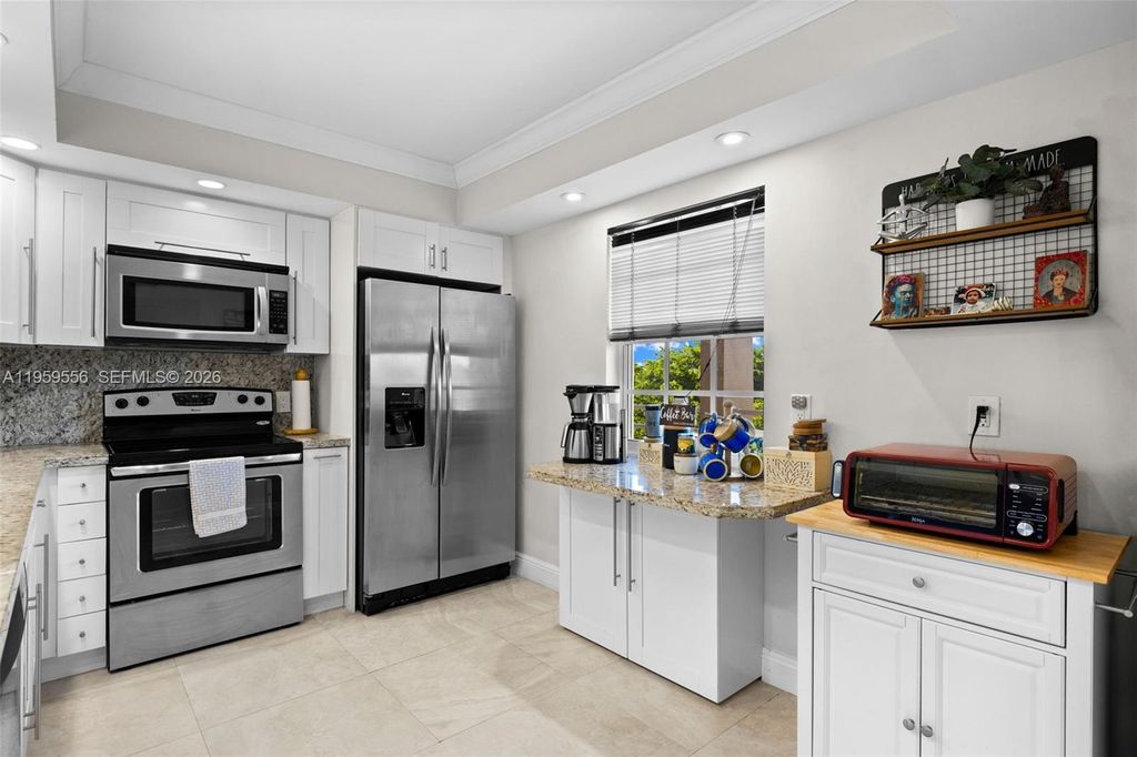 Photo of 3850 Oaks Clubhouse Dr #504, Pompano Beach, FL 33069 (MLS # A11959556)