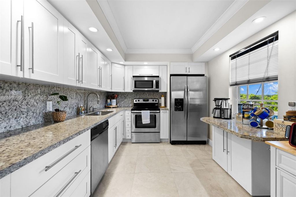 Photo of 3850 Oaks Clubhouse Dr #504, Pompano Beach, FL 33069 (MLS # A11959556)