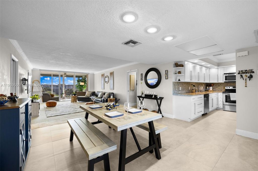 Photo of 3850 Oaks Clubhouse Dr #504, Pompano Beach, FL 33069 (MLS # A11959556)