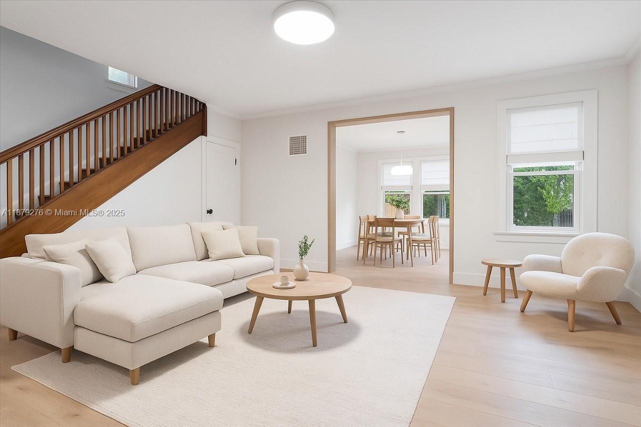 Beautifully renovated 4BR/2BA home in the heart of the Design District. Originally built in 1924, this unique residence features high ceilings, fireplace, Florida room, dining room, great room, and updated kitchen with stainless steel appliances. First floor offers a guest bedroom/office, full bath, and laundry room. Second floor includes the primary suite with access to a large balcony, plus 2 additional bedrooms and full bath. Enjoy a spacious front and backyard with wood deck, wrought iron gates, and new main door/awnings. Perfect for entertaining and just steps from world-class shops, dining, and nightlife. A true jewel in prime location!