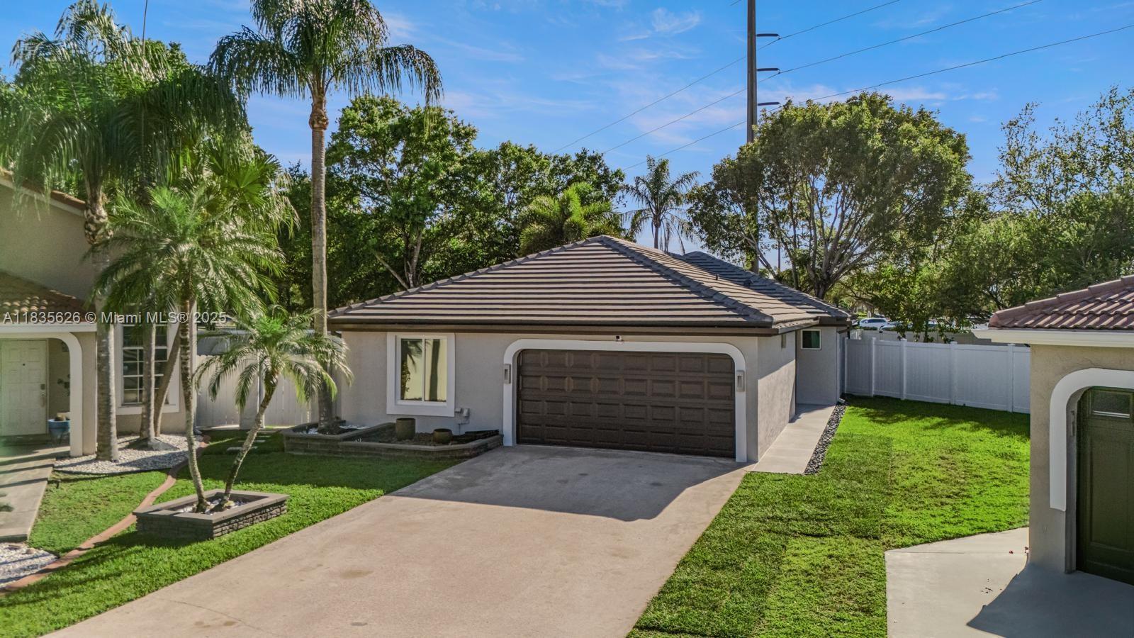 Spectacular, fully remodeled corner lot home! This 4-bedroom, 2-bath gem features impact windows, a newer roof (under 5 years), updated A/C, and is move-in ready. Enjoy the ultimate Florida lifestyle with a private pool, elegant pergola, and fully equipped outdoor kitchen. Whole-house water purification system, modern security with cameras and smart doorbell, new A/C ducts, high-efficiency water heater, upgraded garage with A/C, attic storage, LED-lit pool with jets, custom closets, hidden TV wiring, and more.