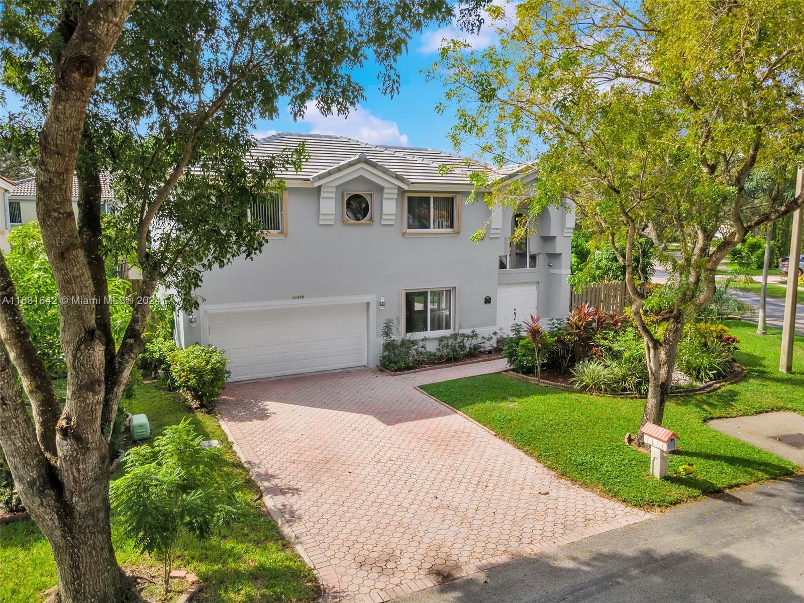 Brand New Roof and All New Impact Windows and Doors on this beautifully updated 3 bed 2.5 bath PLUS LOFT and En Suite Primary. Single-family home on corner lot in desirable gated community Reflections in Cooper City, known for its A-rated schools from elementary through high school and countless community events.
Hardwood and tile floors flow through the open-concept layout. Kitchen features granite countertops, stainless-steel appliances and breakfast nook. Freshly painted interior and exterior and Brand-New Concrete Tile Roof and Impact Windows and doors, enhancing the home’s curb appeal, longevity, security and value. Enjoy fresh fruits from your Mango, Banana and Coconut trees. Community has pool and gym, and Cooper City Pool and Tennis Center is just minutes away.