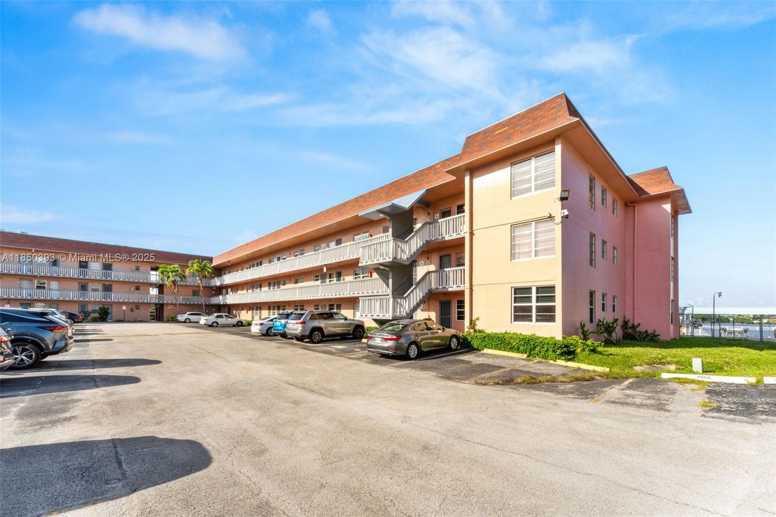 Rarely available 2-bedroom unit with serene lake views in a well-maintained 55+ community! This beautifully updated condo features impact windows throughout, a modern kitchen and bathroom, stylish flooring, and the convenience of an in-unit washer and dryer. Enjoy tranquil water views from the living room and primary bedroom. The community offers a wide range of amenities including two lakeside pools (one heated), gym, library, clubhouse, conference room, walking path around the lake, and assigned parking with guest spaces available. Conveniently located just minutes from Aventura Mall, Sunny Isles Beach, Publix, LA Fitness, restaurants, and major highways. Low monthly maintenance and no current assessments—50-Year Recertification complete. Peaceful living, unbeatable location!