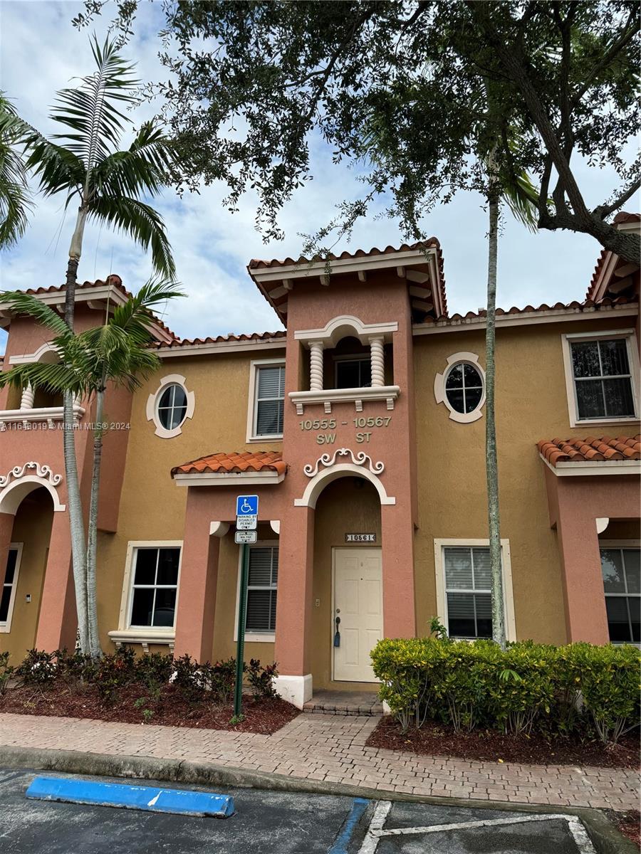 Charming 2-bedroom, 2.5-bathroom townhouse condo situated in the heart of Pembroke Pines. This home is in a gated community and offers convenient access to everything you need. The first floor features tile flooring, while the second floor boasts recently installed wood floors. The condo comes with two assigned parking spaces, a newer washer and dishwasher, and updated A/C coils. 2 master bedrooms on 2nd floor with walk in closet. Enjoy the privacy of your own backyard, perfect starter home.