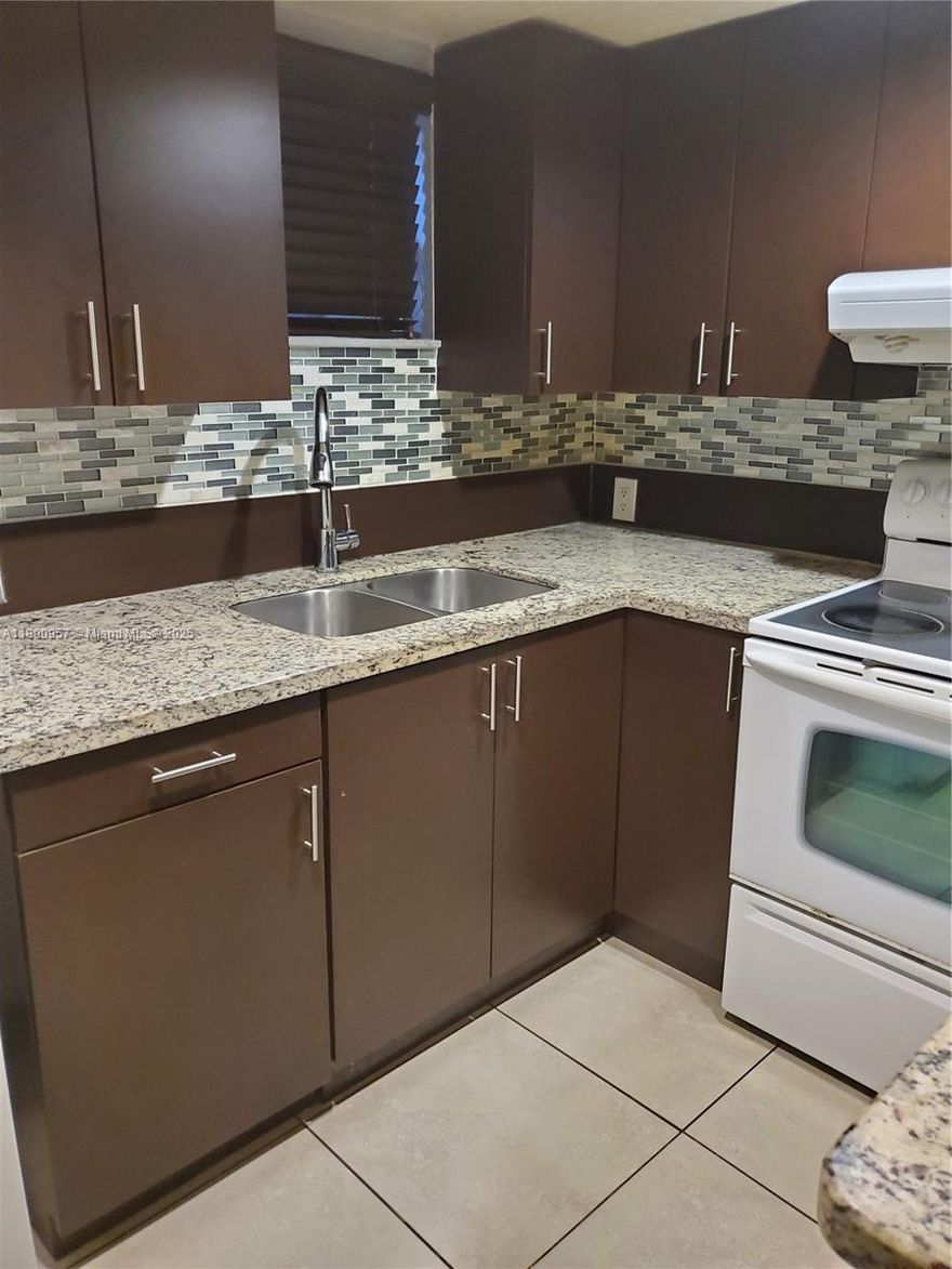 Large and spacious unit at Las Vistas at Doral! Kitchen tastefully remodeled, Ceramic tile throughout, large social area plus two large bedrooms, each with walking closet. Enjoy a very comfortable and private split plan. WASHER AND DRYER. Las Vistas is a gated community in the Downtown Doral Area that offers four swimming pools, tennis and racquetball courts, gym and clubhouse with party room and barbecue area. Close to everything!! Steps away from Downtown Doral dining and entertainment venues, access to Doral's A+ schools. Minutes from all major highways! Freebie service available. Easy to show, fast appoval process.