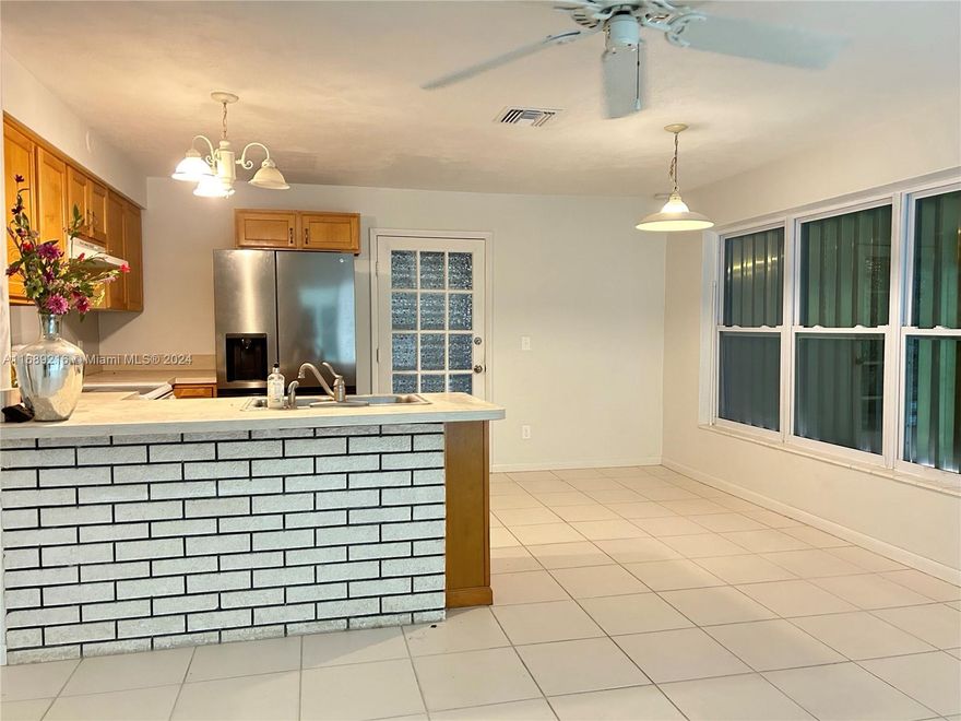 Beautiful and quite 2 bedrooms and and 1 bathroom home with a bonus room easy to use for a 3rd bedroom, leaving and dining room, kitchen, separate utility room, with a small room perfect for an office. Brand new central air system including new ducting, tile floors, new paint in and out. Very clean. Fenced back yard for a pet, carport attached. Room for a boat, a trailer and an RV. Located on a residential quite no thru traffic street, 1/4 mile from US1. No HOA. Great neighborhood. Easy moving...owner financing 30% down only for investors. Also for rent for $2300 per month