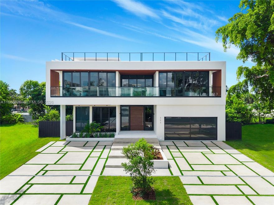 BRAND NEW BUILD MODERN ESTATE IN THE HEART OF SUNNY ISLES BEACH! Furnished by Artefacto! Modern Tropical Oasis Lined with Lush Landscaping Encompassing 5 Bedrooms + 5 Baths + Powder Room in 4,140 Interior SF on 7,500 SF LOT. Open Floorplan with Calacatta Flooring on Ground Level featuring Entertaining Spaces + Wine Cellar. Soaring Ceilings with Recessed Lighting & Drop Ceilings. Spacious Primary Suite with Dramatically-Lit Accent Wall. Custom Italian Kitchen with Oversized Island Countertop & SubZero Appliances. Primary Baths with Hansgrohe & Duravit Fixtures + Rainshower. Indoor/Outdoor Living with Deck Perfect for Entertaining. Located in the Heart of Sunny Isles Beach, Near Aventura Mall, Dining & Oleta River State Park. Ready to Move In!