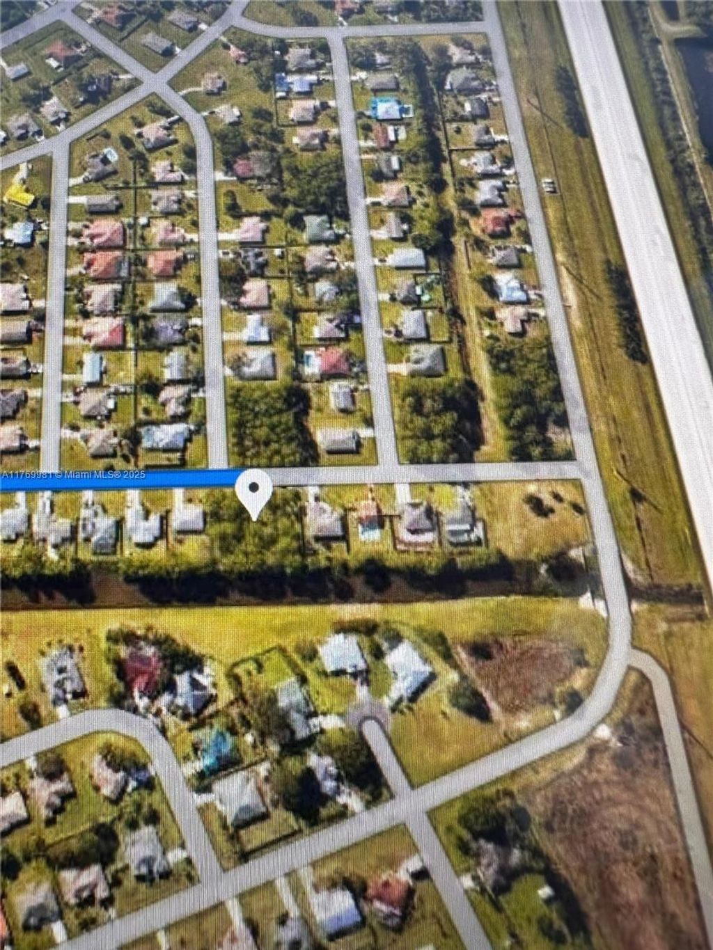 Photo of 841 Archer Ave, Port Saint Lucie, FL 34983 (MLS # A11769981)