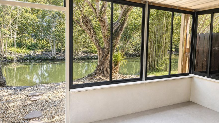 BEST location in the complex, rarely available unit on the canal with gorgeous view from Sun Room. Substantially and tastefully remodeled 2 bedrooms/ 2 full baths + covered back patio (Sun Room). Easy access to 95, Turnpike and 826. Stainless appliances, glass cabinet accent doors, quartz countertops, modern fixtures, designer paint, new doors/ windows/ trim and baseboards throughout. 2 assigned parking spaces on your doorstep. Complex just passed 50-year recertification. Nice sized pool and tennis court in the community. AS-IS, see Broker Remarks for showing instructions. All ages welcome. Easy to show. Come get your own slice of paradise!