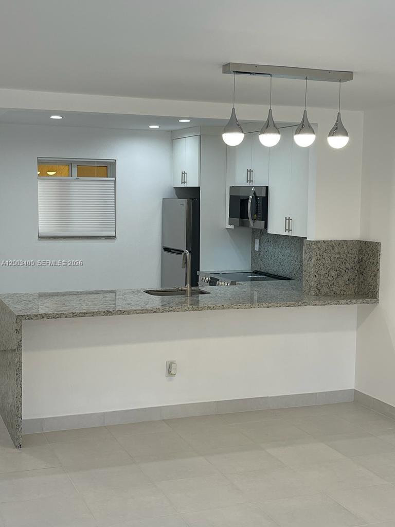 7732 Camino Real F-318