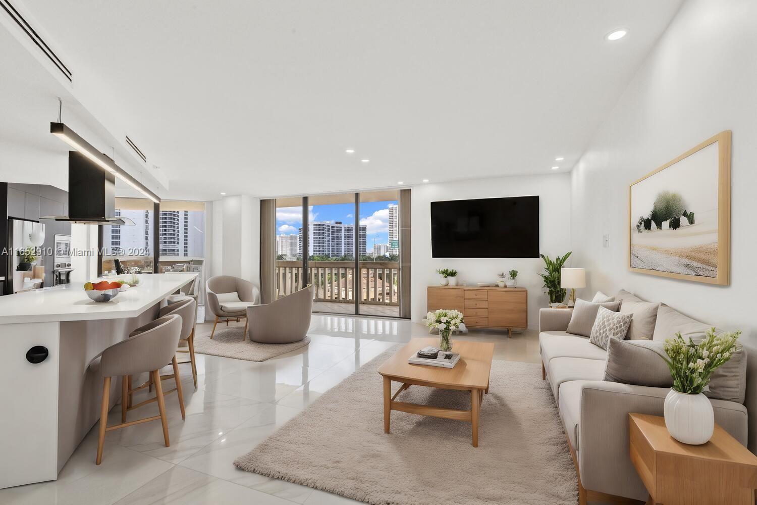 Step into this stunningly remodeled, partially urnished, 2-bedroom, 2-bath condo where every detail exudes perfection. With 1,522 sq. ft. of bright, airy space, this residence redefines modern luxury. The expansive open kitchen features a large island ideal for dining and entertaining, complemented by elegant porcelain flooring throughout. Custom closets offer ample storage, while the master suite boasts a spacious rain shower enclosed in glass, a separate soaking tub for ultimate relaxation, and double sinks. Electric shades throughout. Enjoy abundant natural light from the large wrap-around balcony. Walk to House Of Worship, Aventura Mall, Shops and Restaurants, Turnberry is going through construction but all the amenities except the pool are open. The balconies are closed temporarily.