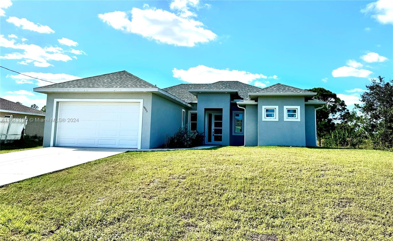 PRICE REDUCTION! New construction, this property is situated in the expanding city of Lehigh Acres. A brand-new construction and an expansive lot that offers ample space for a pool. Despite its secluded and private location, it remains conveniently accessible to the city center, major shops, and markets close to Sunshine & Lee Blvd. Impact doors and windows, beautiful granite countertops, wooden cabinets with a convenient lazy Susan and door handles matching stainless-steel appliances. Master bathroom depicts spacious his and hers walking closets, dual sink, wooden cabinetry and glass enclosed shower with luxurious rain shower system. Take advantage of this amazing opportunity!