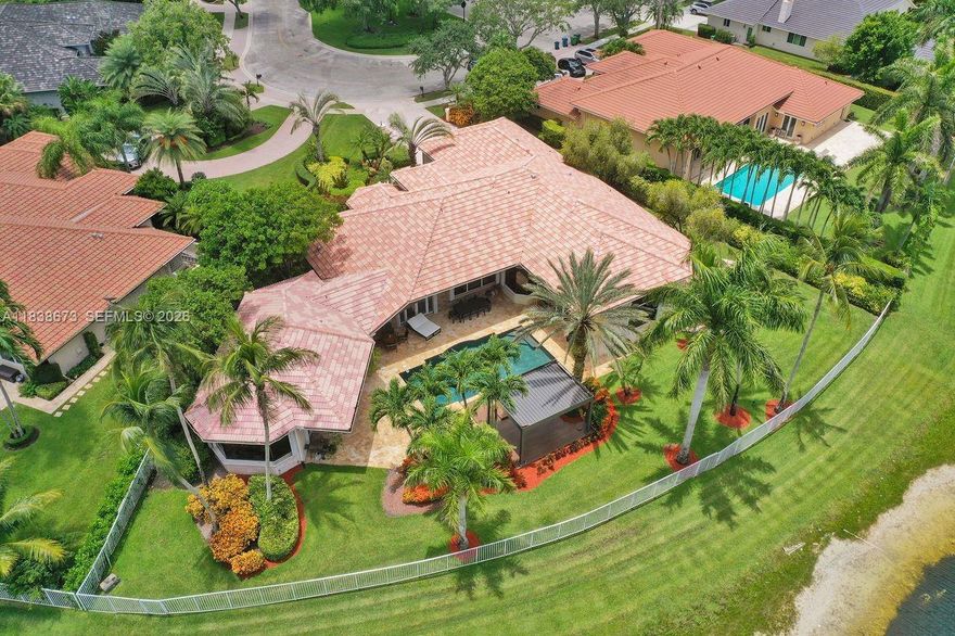 We are pleased to present this rarely available home in WHCC with huge 1/1 Guest House on over 1/2 acre waterfront point lot! This was built by Issa and is one of the largest one-story homes in WHCC with over 6500 sf total area and 6 bedrooms and 4 bathrooms in main house. Home is located in a cul-de-sac with 3 car garage and driveway for multiple cars. Home has a beautiful open split floor plan with high ceilings and views of lake from all main areas. Kitchen w/ granite, wolf & Viking appliances, real hardwood flooring and beautifully updated bathrooms, accordion shutters etc. Only a few homes with this large guest house with views of lake. Absolutely stunning remodeled outdoor pool area with tumbled marble pavers and gorgeous wide lake views. Bring all offers!!