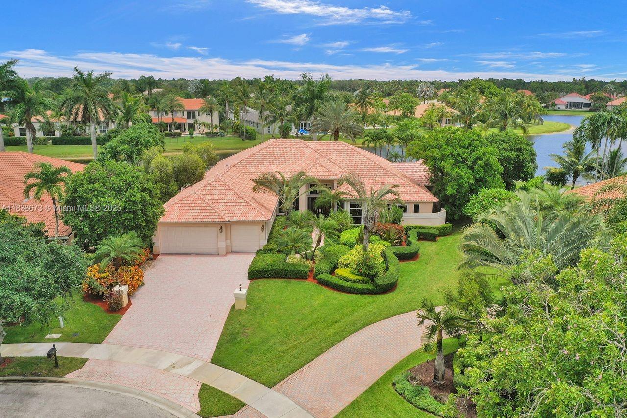 We are pleased to present this rarely available home in Weston Hills Country Club with huge 1/1 Guest House on over 1/2 acre waterfront point lot! This was built by Issa and is one of the largest one-story homes in WHCC with over 6500 sf total area and 6 bedrooms and 4 bathrooms in main house. Home is located in a cul-de-sac with 3 car garage and driveway for multiple cars. Home has a beautiful open split floor plan with high ceilings and views of lake from all main areas. Kitchen w/ granite and Viking appliances, real hardwood flooring and beautifully updated bathrooms, accordion shutters etc. Only a few homes with this large guest house with views of lake. Absolutely stunning remodeled outdoor pool area with tumbled marble pavers and gorgeous wide lake views. This home will not last!