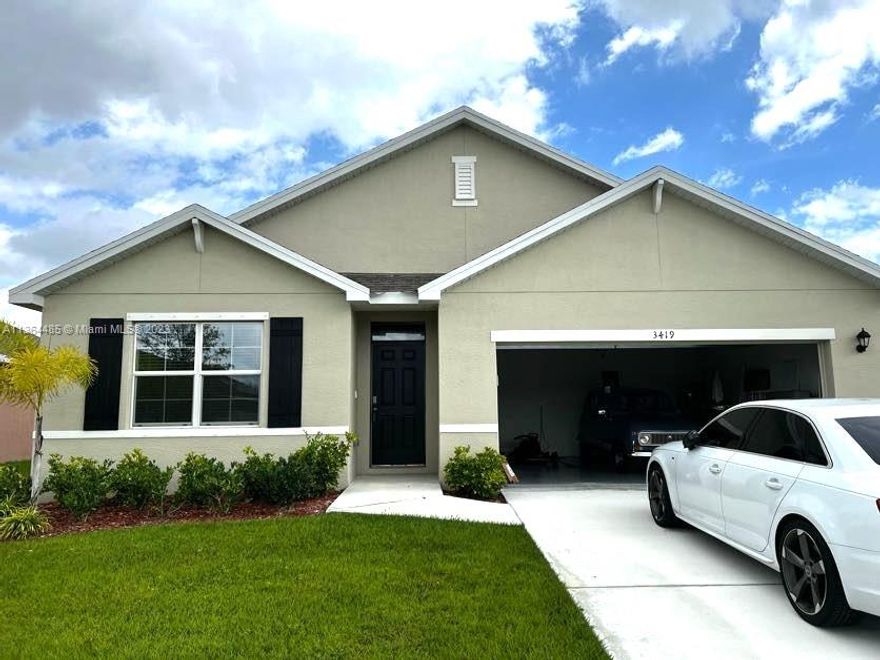 This gorgeous brand new construction features 4 bedrooms, 2 bathrooms and a 2 car garage with a spectacular lake view. It has an open floor plan ideal for large families and for entertaining. Large master bedroom with a spacious walk in closet. The Laundry room has a full size washer and dryer. It is located in the Creekside community, one of the most desirable communities in Ft. Pierce. Conveniently located close to the highway. Move-in ready. All measurements are approximate.